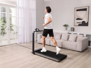 Man jogging on a Kingsmith WalkingPad X21 in a living room (manufacturer image)